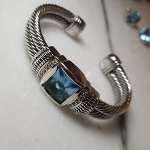 Twisted cable cuff w/ light blue stone